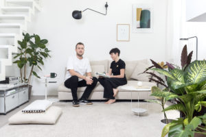 Portrait on sofa of Riccardo Crenna and Simona Flacco, founders of Simple Flair, in their Simple Flair Apartment Photographer Maria Teresa Furnari