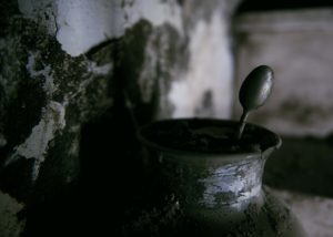 A vase full of mud and a spoon one of the trail of Giampilieri after the flood Photographer Maria Teresa Furnari